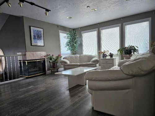 17423 Highway 2, High Prairie, AB - Indoor Photo Showing Living Room With Fireplace