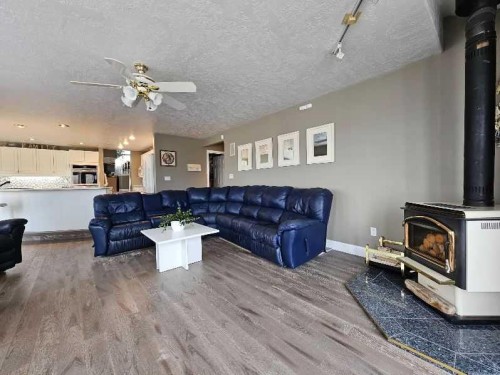 17423 Highway 2, High Prairie, AB - Indoor Photo Showing Living Room With Fireplace