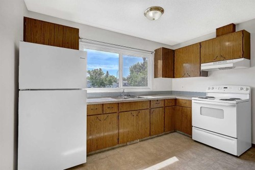 11448 97 Street, Grande Prairie, AB - Indoor Photo Showing Kitchen With Double Sink