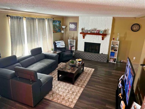 5404 46 Street, Valleyview, AB - Indoor Photo Showing Living Room With Fireplace