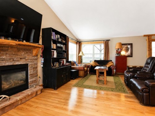14-71332 Range Road 262, Ridgevalley, AB - Indoor Photo Showing Living Room With Fireplace