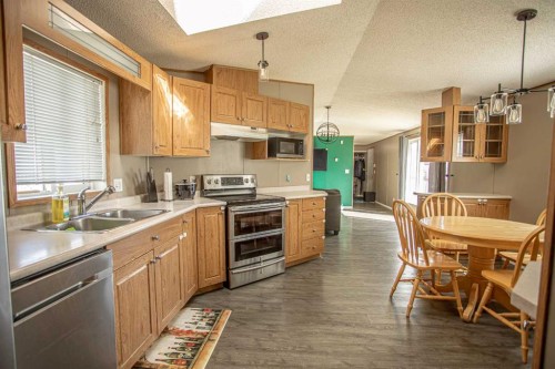 11 Deer Ridge Drive, High Level, AB - Indoor Photo Showing Kitchen With Double Sink