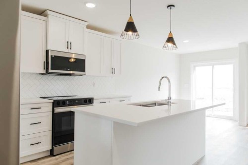 9520 114 Avenue, Clairmont, AB - Indoor Photo Showing Kitchen With Double Sink With Upgraded Kitchen