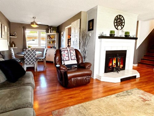 11002 Hoppe Avenue, Grande Cache, AB - Indoor Photo Showing Living Room With Fireplace