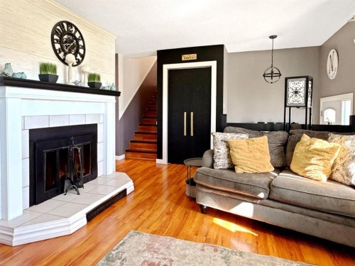 11002 Hoppe Avenue, Grande Cache, AB - Indoor Photo Showing Living Room With Fireplace