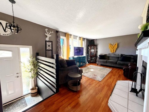 11002 Hoppe Avenue, Grande Cache, AB - Indoor Photo Showing Living Room With Fireplace