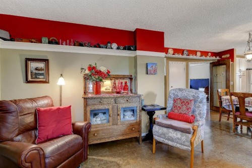 8002 103 Street, Grande Prairie, AB - Indoor Photo Showing Living Room With Fireplace