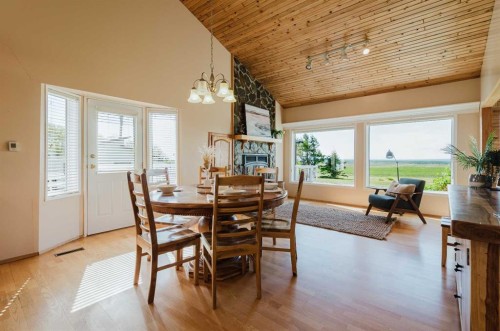 80057 712 Township, Wembley, AB - Indoor Photo Showing Dining Room With Fireplace