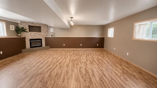 9928 93 Avenue, Wembley, AB - Indoor Photo Showing Other Room With Fireplace