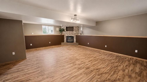 9928 93 Avenue, Wembley, AB - Indoor Photo Showing Other Room With Fireplace
