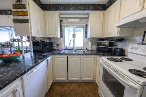 9915 99 Street, Wembley, AB - Indoor Photo Showing Kitchen With Double Sink