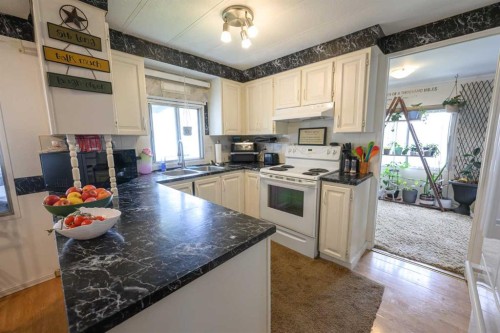 9915 99 Street, Wembley, AB - Indoor Photo Showing Kitchen With Double Sink