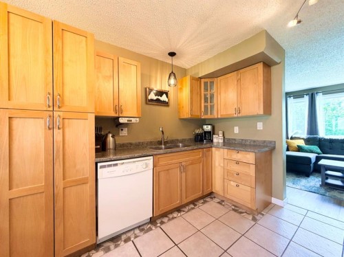 53 97 Avenue, Grande Cache, AB - Indoor Photo Showing Kitchen With Double Sink