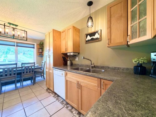 53 97 Avenue, Grande Cache, AB - Indoor Photo Showing Kitchen With Double Sink