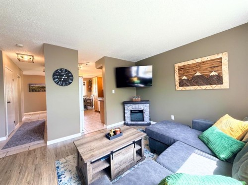 53 97 Avenue, Grande Cache, AB - Indoor Photo Showing Living Room With Fireplace