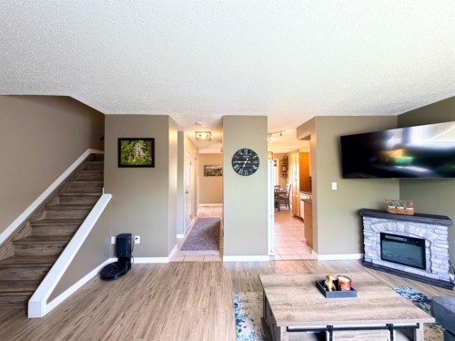 53 97 Avenue, Grande Cache, AB - Indoor Photo Showing Other Room With Fireplace