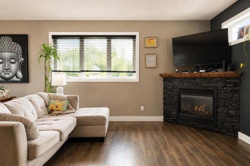 10619 84 Street, Peace River, AB - Indoor Photo Showing Living Room With Fireplace