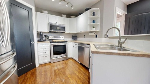 7901 Westpointe Drive, Grande Prairie, AB - Indoor Photo Showing Kitchen With Double Sink