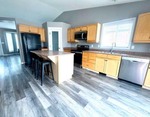 140 Pinnacle Boulevard, Grande Prairie, AB - Indoor Photo Showing Kitchen With Double Sink