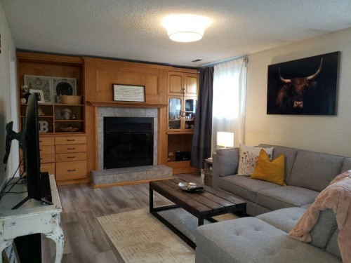 10213 106 Avenue, Fairview, AB - Indoor Photo Showing Living Room With Fireplace