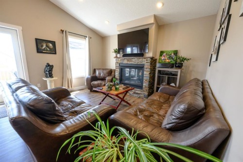 9211 95 Avenue, Wembley, AB - Indoor Photo Showing Living Room With Fireplace