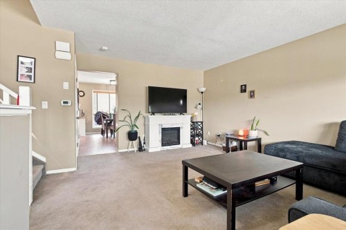 6918 88A Street, Grande Prairie, AB - Indoor Photo Showing Living Room With Fireplace