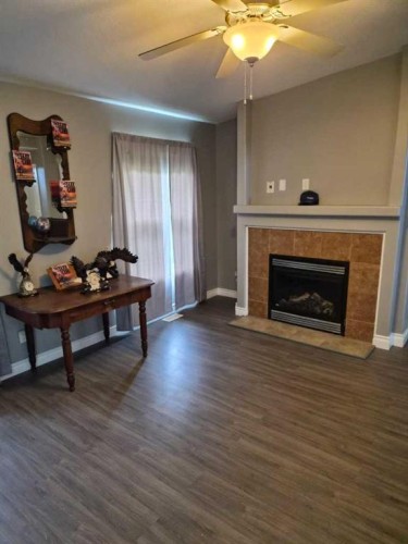 721023 Range Road 113, Beaverlodge, AB - Indoor Photo Showing Living Room With Fireplace