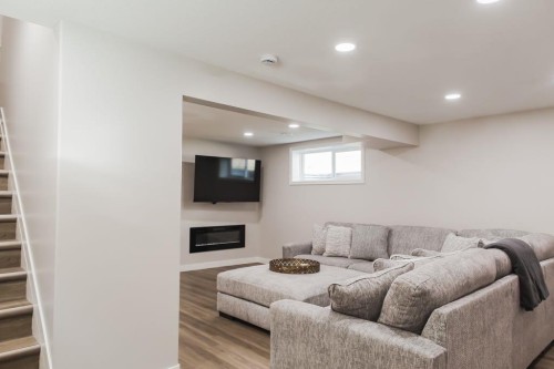 8852 96 Avenue, Grande Prairie, AB - Indoor Photo Showing Basement With Fireplace