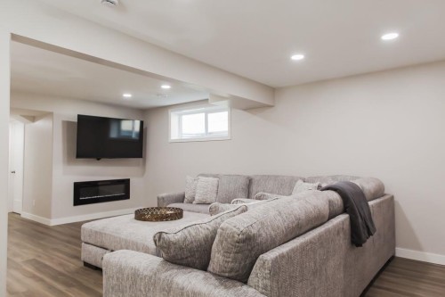 8852 96 Avenue, Grande Prairie, AB - Indoor Photo Showing Basement With Fireplace