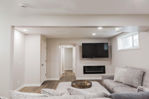 8852 96 Avenue, Grande Prairie, AB - Indoor Photo Showing Living Room With Fireplace