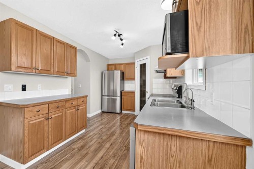 151 Applestone Park Se, Calgary, AB - Indoor Photo Showing Kitchen With Double Sink