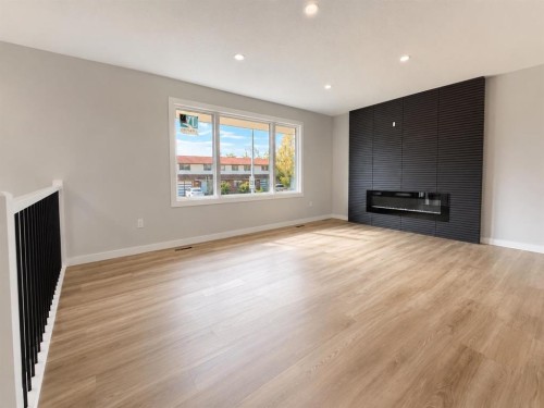 10902 97Th Avenue, Grande Cache, AB - Indoor Photo Showing Other Room With Fireplace