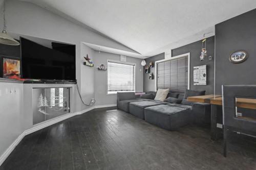 8 Pinnacle Way, Grande Prairie, AB - Indoor Photo Showing Living Room With Fireplace