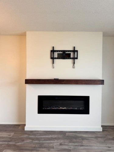 10713 105 Avenue, Fairview, AB - Indoor Photo Showing Living Room With Fireplace
