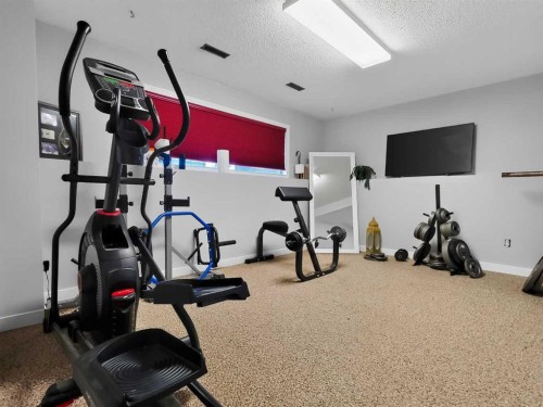 727 Oak Drive, Beaverlodge, AB - Indoor Photo Showing Gym Room