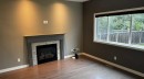 8105 112 Street, Grande Prairie, AB  - Indoor Photo Showing Living Room With Fireplace 