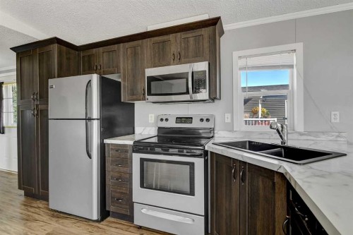 12128 98 Street, Grande Prairie, AB - Indoor Photo Showing Kitchen With Double Sink