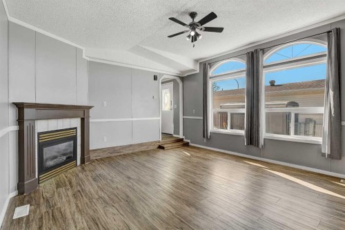 12128 98 Street, Grande Prairie, AB - Indoor Photo Showing Living Room With Fireplace