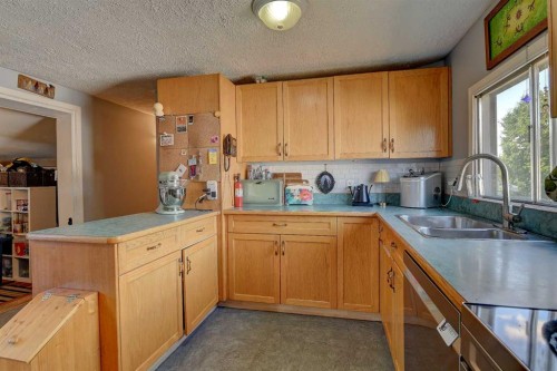12038 97 Street, Grande Prairie, AB - Indoor Photo Showing Kitchen With Double Sink