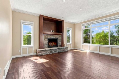 9335 Lakeshore Court, Grande Prairie, AB - Indoor Photo Showing Living Room With Fireplace