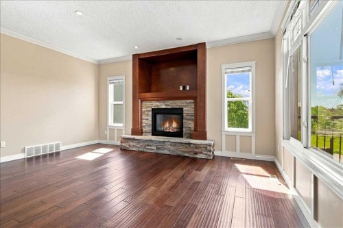 9335 Lakeshore Court, Grande Prairie, AB - Indoor Photo Showing Living Room With Fireplace