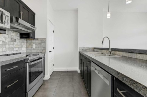 8006 112A Street, Grande Prairie, AB - Indoor Photo Showing Kitchen With Stainless Steel Kitchen With Double Sink With Upgraded Kitchen