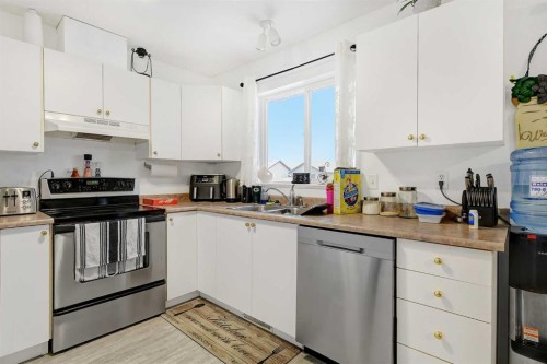 7209 105 Street, Grande Prairie, AB - Indoor Photo Showing Kitchen With Double Sink