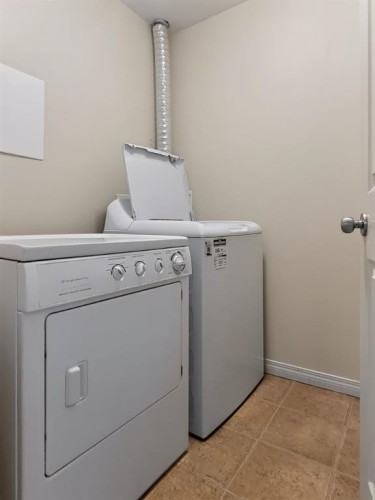 302-9810 96 Street, Grande Prairie, AB - Indoor Photo Showing Laundry Room