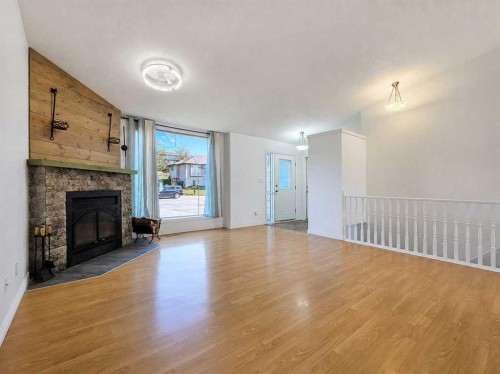 10913 Grande Avenue, Grande Cache, AB - Indoor Photo Showing Living Room With Fireplace