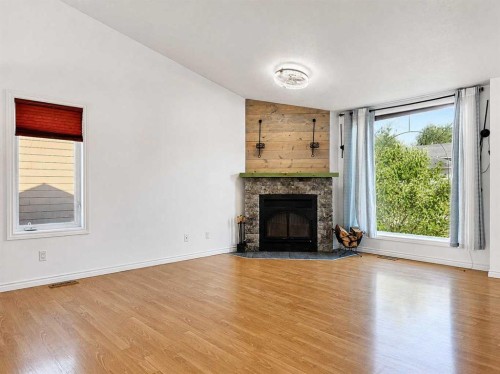 10913 Grande Avenue, Grande Cache, AB - Indoor Photo Showing Living Room With Fireplace