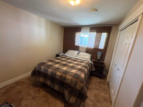 10032 102 Street, Peace River, AB - Indoor Photo Showing Bedroom