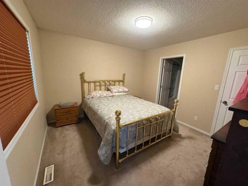 10032 102 Street, Peace River, AB - Indoor Photo Showing Bedroom