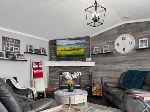 248 Mawdsley Crescent, Grande Cache, AB - Indoor Photo Showing Living Room With Fireplace