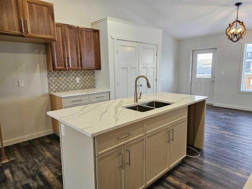 9215 94A Avenue, Wembley, AB - Indoor Photo Showing Kitchen With Double Sink